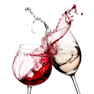 Two wine glasses with red and white liquid splashing out of them.
